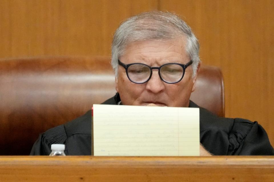 Hinds County Chancery Judge Dewayne Thomas studies his notes at a hearing on Wednesday in Hinds County Chancery Court in Jackson where he heard arguments about a Mississippi law that would create a court system with judges who would be appointed rather than elected.