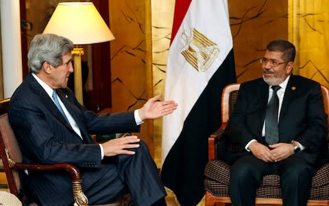 Mohammed Morsi in a meeting with then US Secretary of State, John Kerry, in 2013 - Credit: &nbsp;Jim Young/Reuters