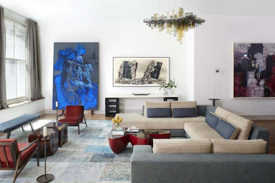 Works by artists Rita Ackerman and William Kentridge fit seamlessly within this multifunctional room by Rodney Lawrence, who intentionally selected art later in the design process to meld with the interiors