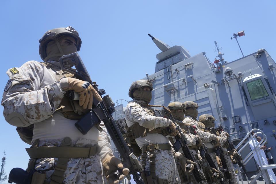 Saudi commandos from Royal Naval Forces stand alert as they guard Al-Jubail military ship on the Red Sea near Jeddah, Saudi Arabia, Wednesday, May 3, 2023 after they end an evacuation mission at Port Sudan. Exhausted Sudanese and foreigners joined growing crowds at Sudan's main seaport Tuesday, waiting to be evacuated from the chaos-stricken nation. After more than two weeks of fighting, areas of the capital of Khartoum appear increasingly abandoned. (AP Photo/Amr Nabil)