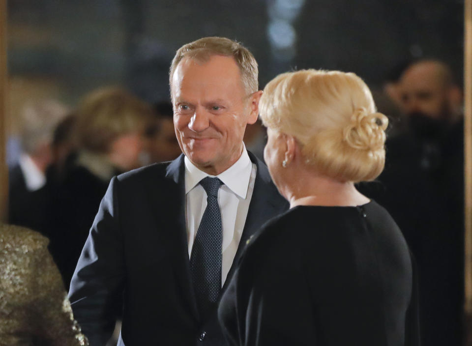 President of the European Council Donald Tusk is welcomed by Romanian Prime Minister Viorica Dancila as he arrives at the Romanian Atheneum concert hall in Bucharest, Romania, Thursday, Jan. 10, 2019, for an event marking the official start of the Romanian Presidency of the Council of the European Union. (AP Photo/Vadim Ghirda)