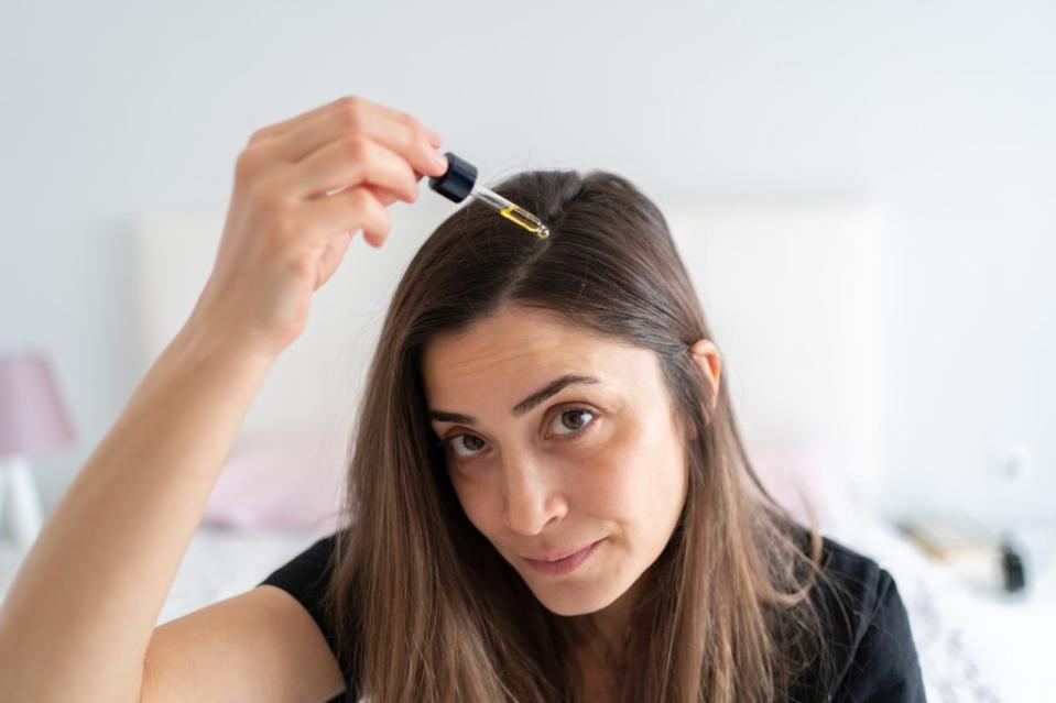 Hair oils are present in many products, but using them in their pure form could create a greasy appearance depending on hair type. Getty Images