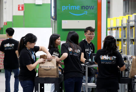 Employees work at Amazon's Prime Now fulfillment centre in Singapore July 27, 2017. REUTERS/Edgar Su