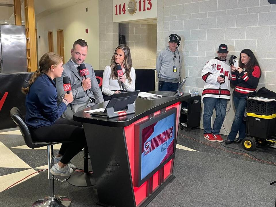 Mary Derrenbacher’s parents Chris and Christy, far right, watch as their daughter, far left, is interviewed by Shane Willis and Hanna Yates on Bally Sports’ pregame show before the Carolina Hurricanes game on Sunday, March 10, 2024.