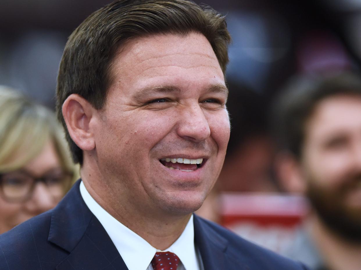 An image of Florida govenror Ron DeSantis laughing