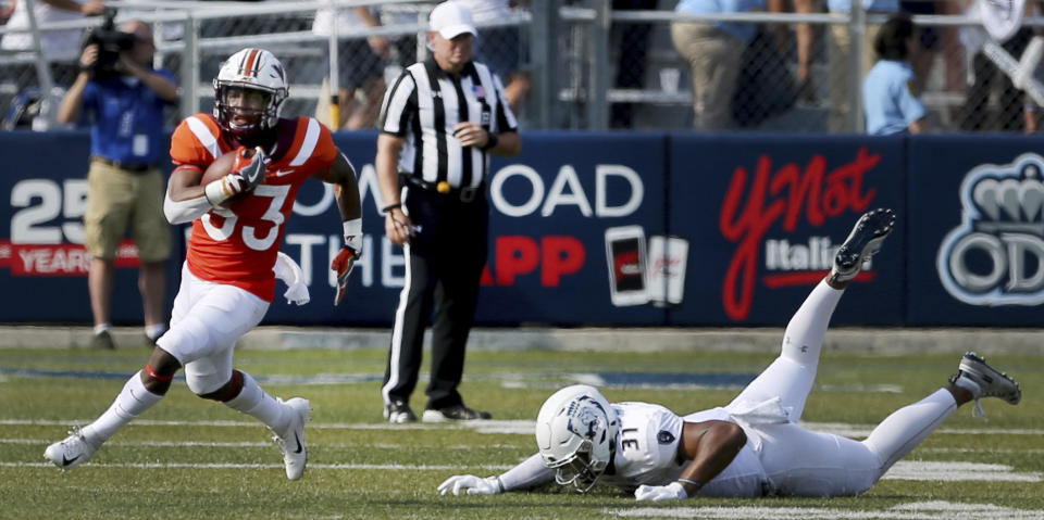 Virginia Tech's DeShawn McClease, left, breaks past Old Dominion's Sean Carter during the first half of an NCAA college football game Saturday, Sept. 22, 2018, in Norfolk, Va. (AP Photo/Jason Hirschfeld)