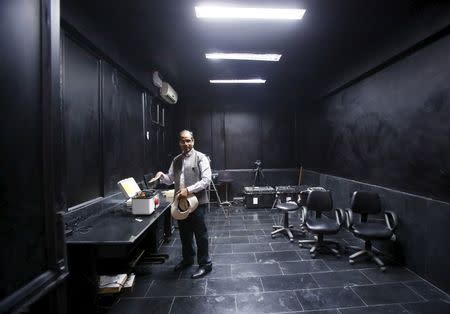 R. N. Sahoo, a senior scientist at the Indian Agricultural Research Institute (IARI), shows a high resolution remote sensor used for crop mapping inside a laboratory at IARI in New Delhi, March 20, 2015. REUTERS/Anindito Mukherjee