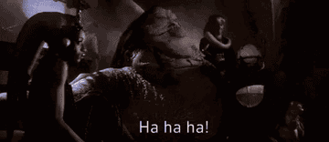 Jabba the Hutt laughing with three other characters in the background from a scene in "Star Wars," subtitle reads "Ha ha ha!"