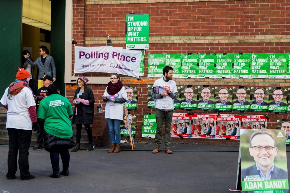 Volunteers hand out voting instruction cards on election day in Melbourne, Australia, on July 2, 2016. (Photo: Anadolu Agency via Getty Images)