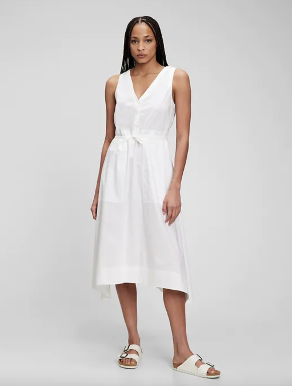 model with black braids wearing white sandals and white Tie-Waist Midi Dress (Photo via Gap)