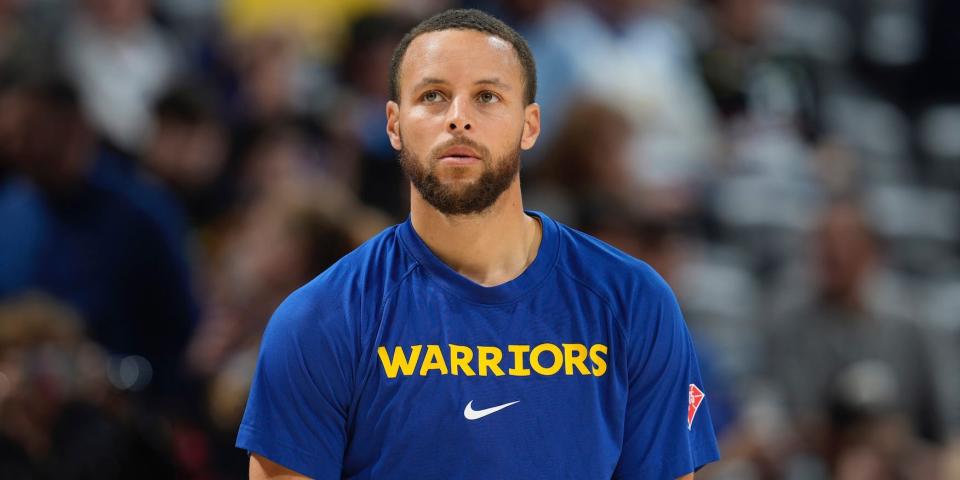 Stephen Curry looks up during warmups in 2022.