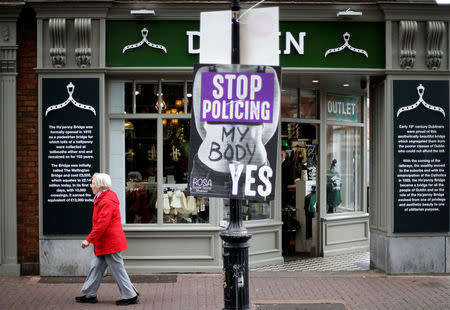 A woman walks past a pro-choice poster in the city centre of Dublin, Ireland, May 22, 2018. REUTERS/Max Rossi