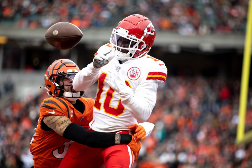 Cincinnati Bengals free safety Jessie Bates (30) knocks the ball away from Kansas City Chiefs wide receiver Tyreek Hill (10) in the end zone in the first half of the NFL game between the Cincinnati Bengals and the Kansas City Chiefs on Sunday, Jan. 2, 2022, at Paul Brown Stadium in Cincinnati. 
