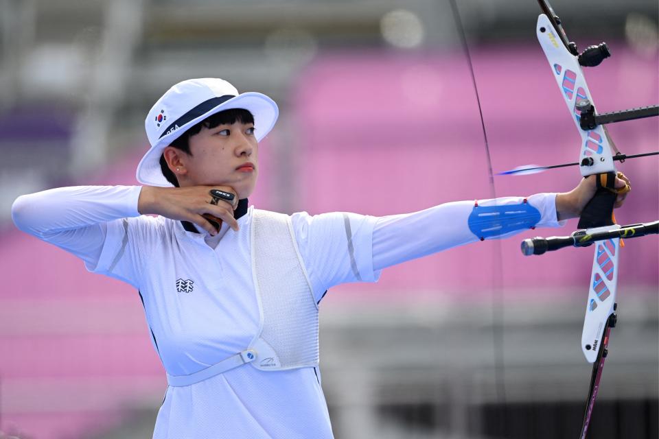 Korean archer An San pulls back her bow