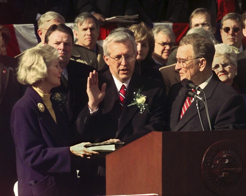 FILE - Tennessee Gov. Don Sundquist is sworn in by Lt. Gov. John Wilder, right, for his second term in Nashville, Tenn. on Jan. 16, 1999. Holding the Bible at left is Gov. Sundquist's wife, Martha. Former governor Sundquist died at Baptist East Hospital in Memphis on Sunday, Aug. 27, 2023, according to a family spokeswoman. (AP Photo/Mark Humphrey, File)