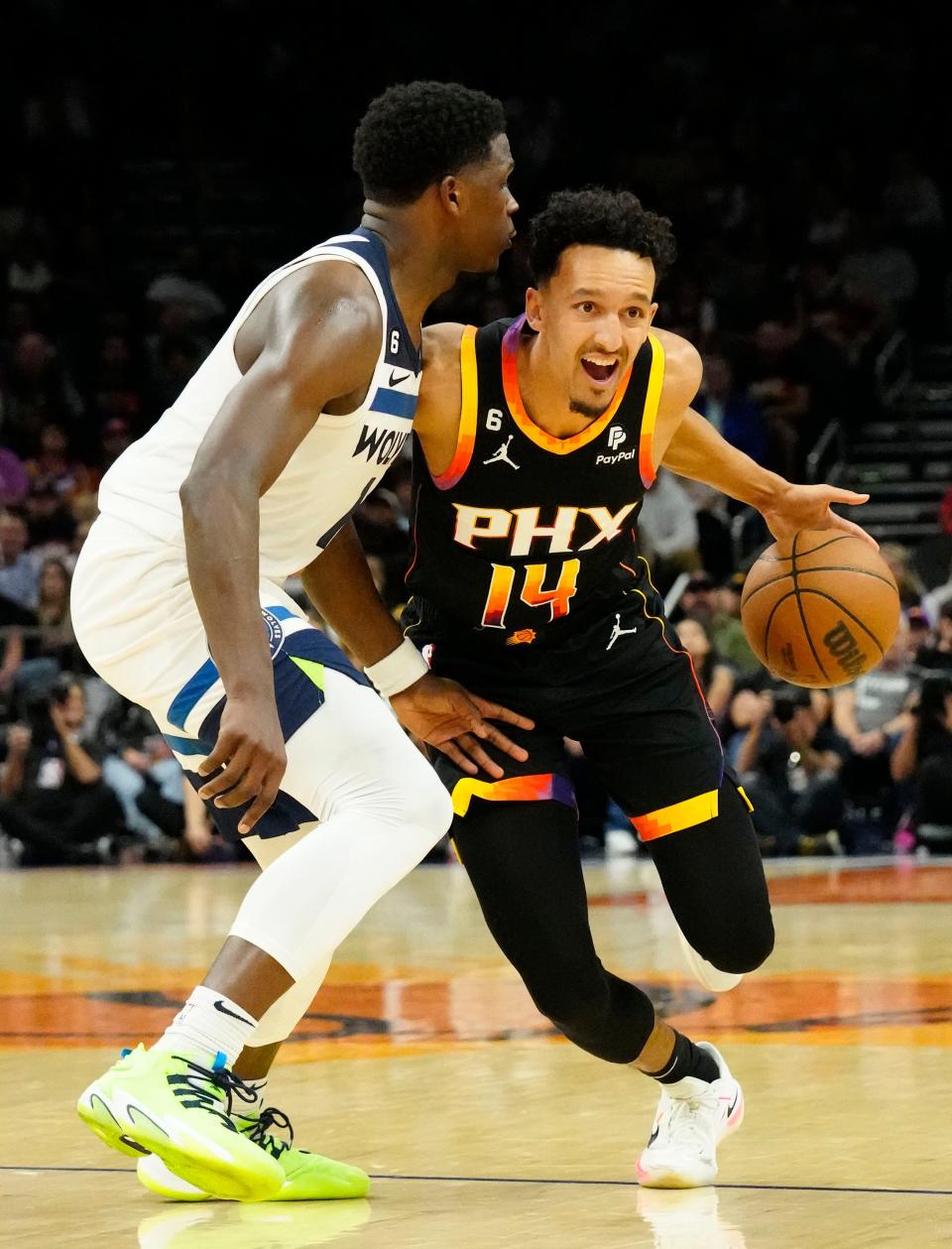 Nov 1, 2022; Phoenix, AZ, USA; Phoenix Suns guard Landry Shamet (14) is pressured by Minnesota Timberwolves guard Anthony Edwards (1) in the second half at Footprint Center.