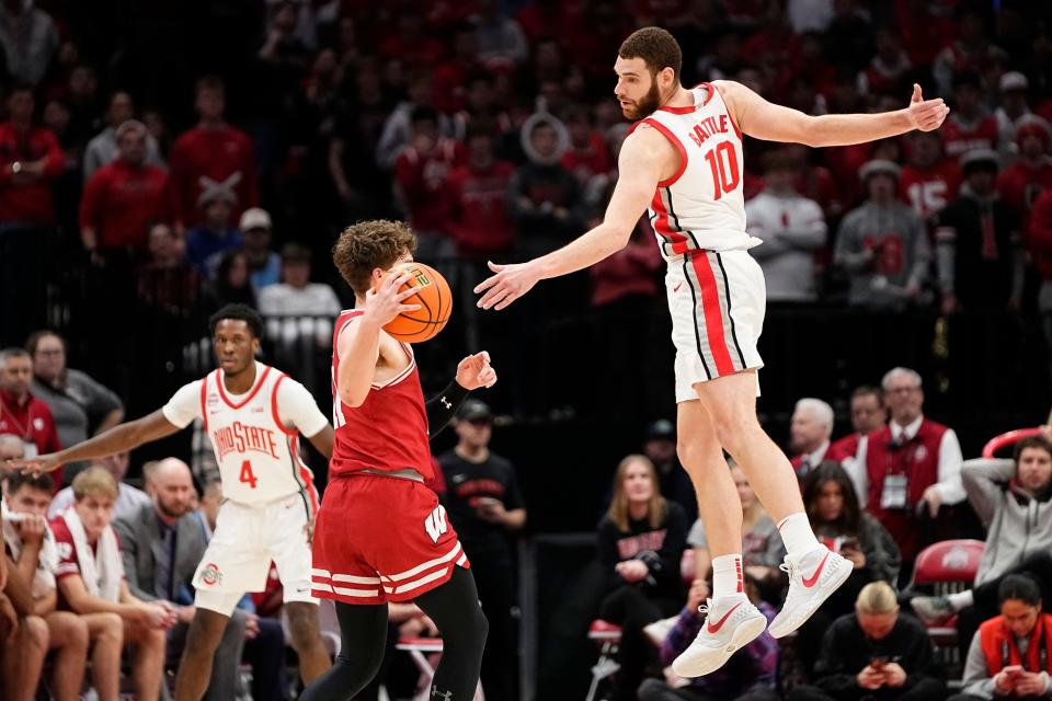 Jan 10, 2024; Columbus, Ohio, USA; Ohio State Buckeyes forward Jamison Battle (10) defends Wisconsin Badgers guard Max Klesmit (11) during the second half of the NCAA men’s basketball game at Value City Arena. Ohio State lost 71-60.
