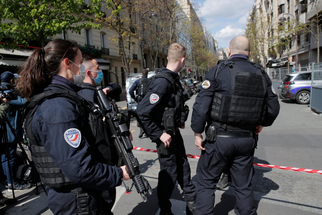 <p>Police officers cordon off the area after a shooting </p> (AP)