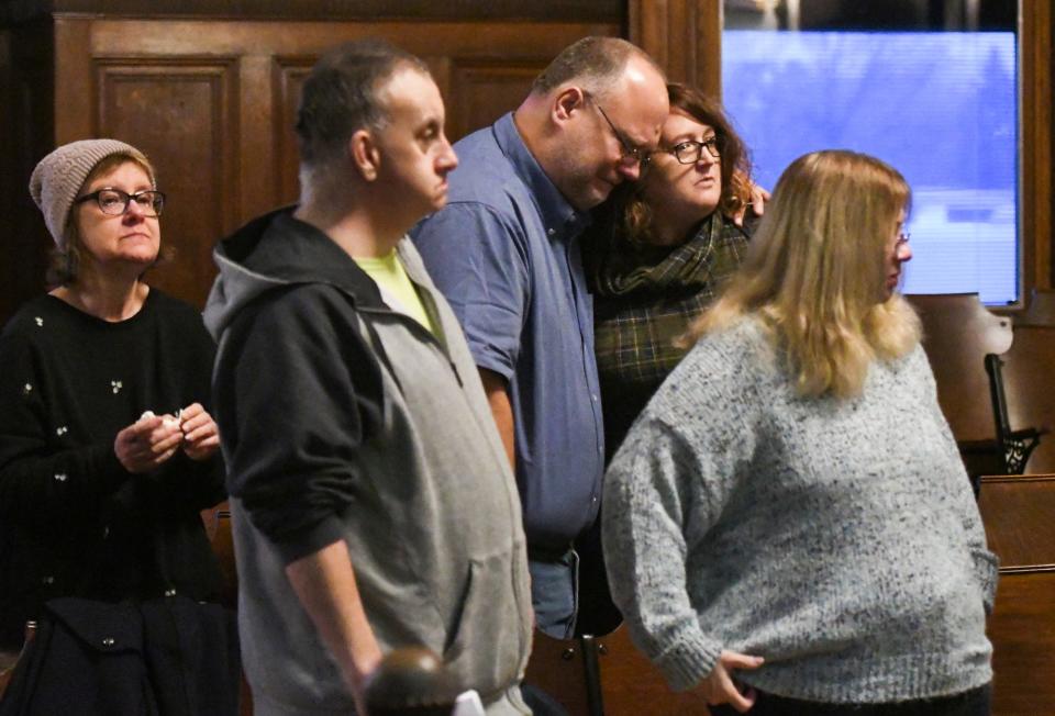 Friends and family of the late Kevin Bacon,25, react at the Shiawassee County Courthouse in Corunna, Mich. Thursday, Dec. 15, 2022, after Mark Latunski was sentenced to life for the 2019 murder and mutilation of Bacon in Latunski's home.