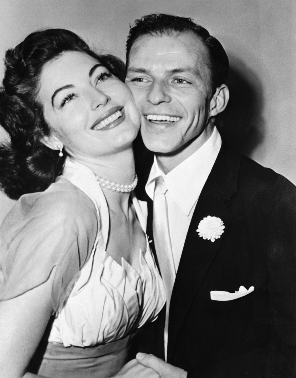 1951: Frank Sinatra and Ava Gardner smoosh faces for the camera
