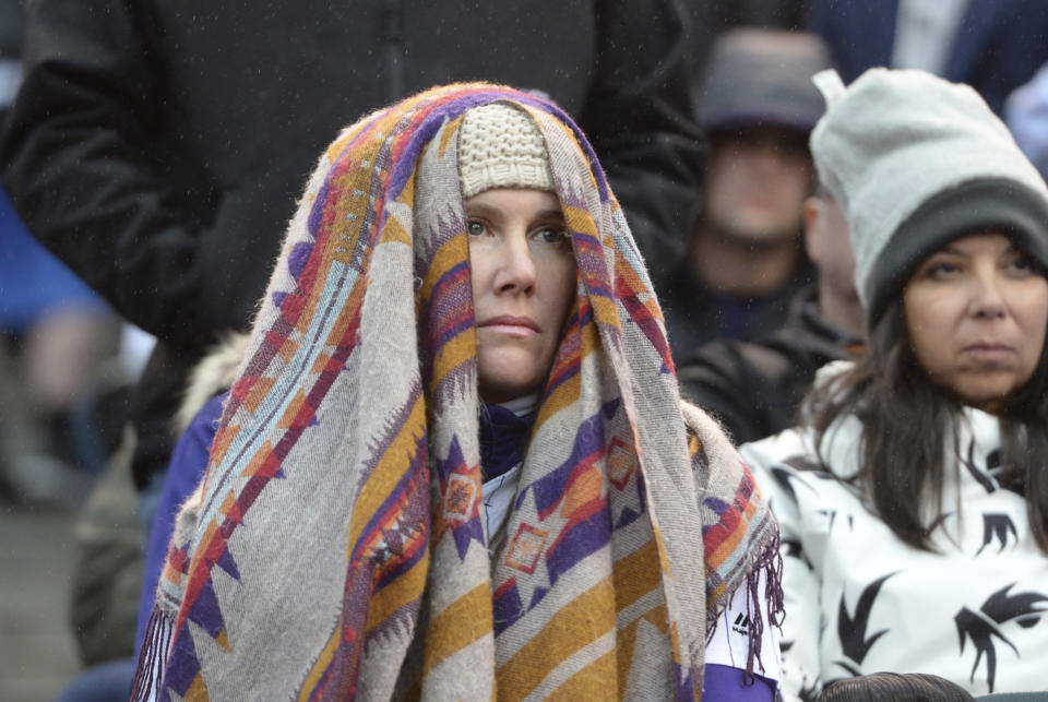 An unidentified fan of the Colorado Rockies looks on as the team falls behind the Milwaukee Brewers in Game 3 of a baseball National League Division Series, Sunday, Oct. 7, 2018, in Denver. The Brewers won to sweep the series in three games and move on to the National League Championship Series. (AP Photo/Joe Mahoney)