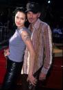 <p>In this snap, Ange cuddles up to her second husband Billy Bob Thornton. And yes, this is his name tattooed on her arm. [Photo: Getty] </p>