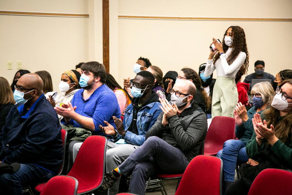 Community members applaud a person after speaking during public comment at an Iowa City Community School District board of directors meeting, Tuesday, Nov. 23, 2021, at the district's Educational Services Center (ESC) at 1725 North Dodge Street in Iowa City, Iowa.