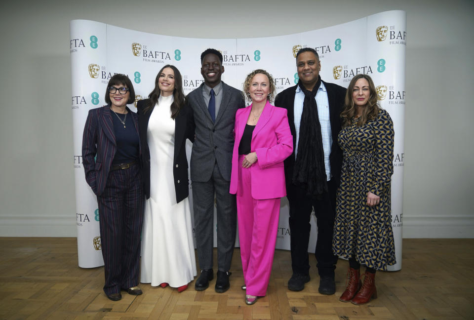 From left CEO of BAFTA Jane Millichip, actress Hayley Atwell, actor Toheeb Jimoh, Chair of BAFTA Film Committee Anna Higgs, Chair of BAFTA Krishnendu Majumdar and BAFTA Executive Director of Awards and Content Emma Baehr pose for a photo during the nominations for the BAFTA Film Awards 2023, at BAFTA's headquarters in London, Thursday, Jan. 19, 2023. (Yui Mok/PA via AP)