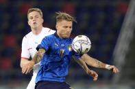 Italy's Ciro Immobile, right, is challenged by Czech Republic's David Zima during the international friendly soccer match between Italy and Czech Republic in Bologna, Italy, Friday, June 4, 2021. (AP Photo/Antonio Calanni)