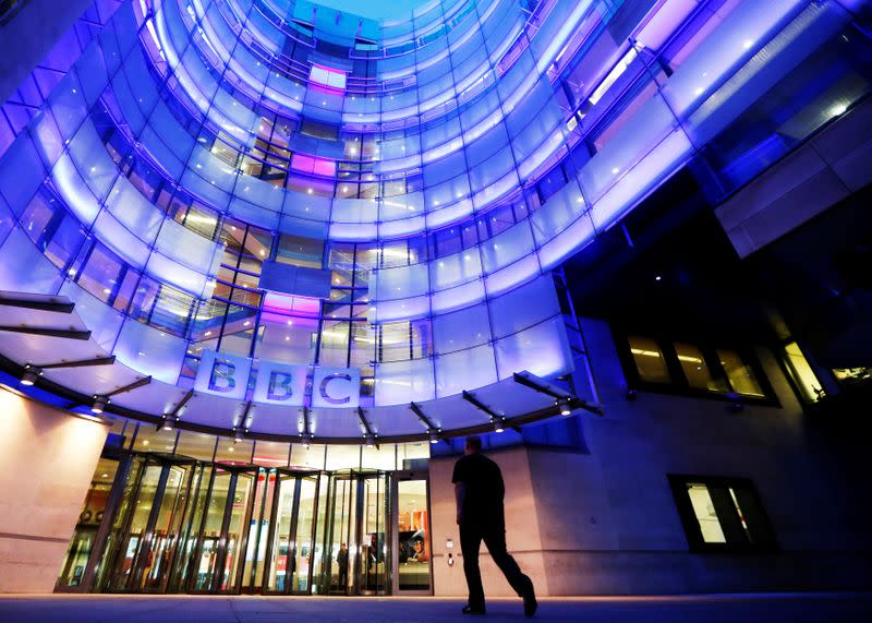 FILE PHOTO: A man enters BBC New Broadcasting House in London