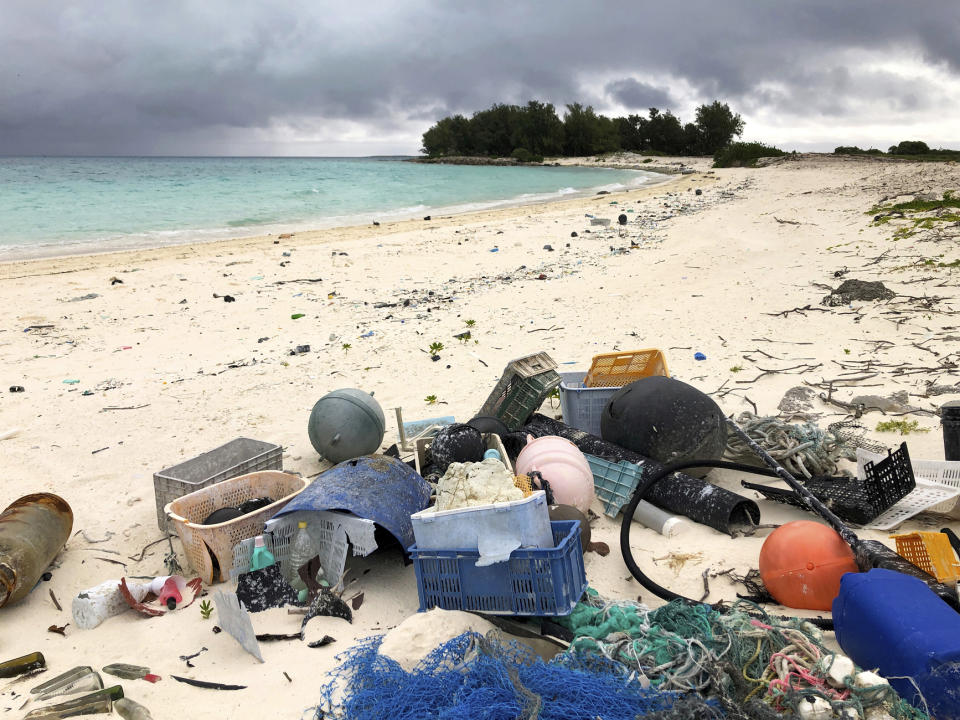 In this Oct. 22, 2019, photo, plastic and other marine debris sits on the beach on Midway Atoll in the Northwestern Hawaiian Islands. In one of the most remote places on Earth, Midway Atoll is a wildlife sanctuary that should be a safe haven for seabirds and other marine animals. Instead, creatures here struggle to survive as their bellies fill with plastic from faraway places. (AP Photo/Caleb Jones)