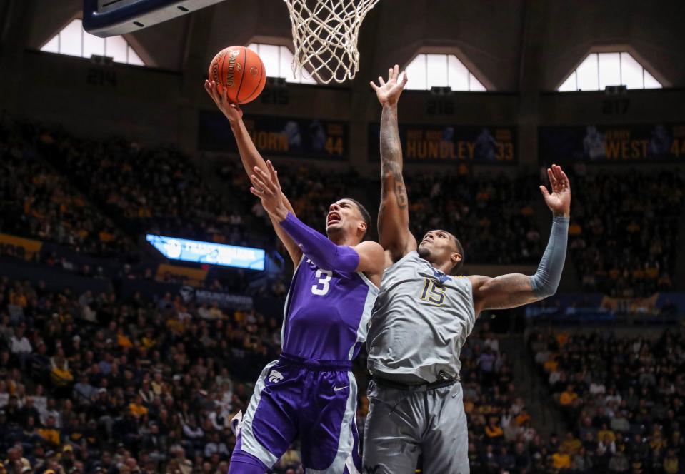 Kansas State forward David N'Guessan (3) shoots against West Virginia's Jimmy Bell Jr. during the first half Saturday at WVU Coliseum.