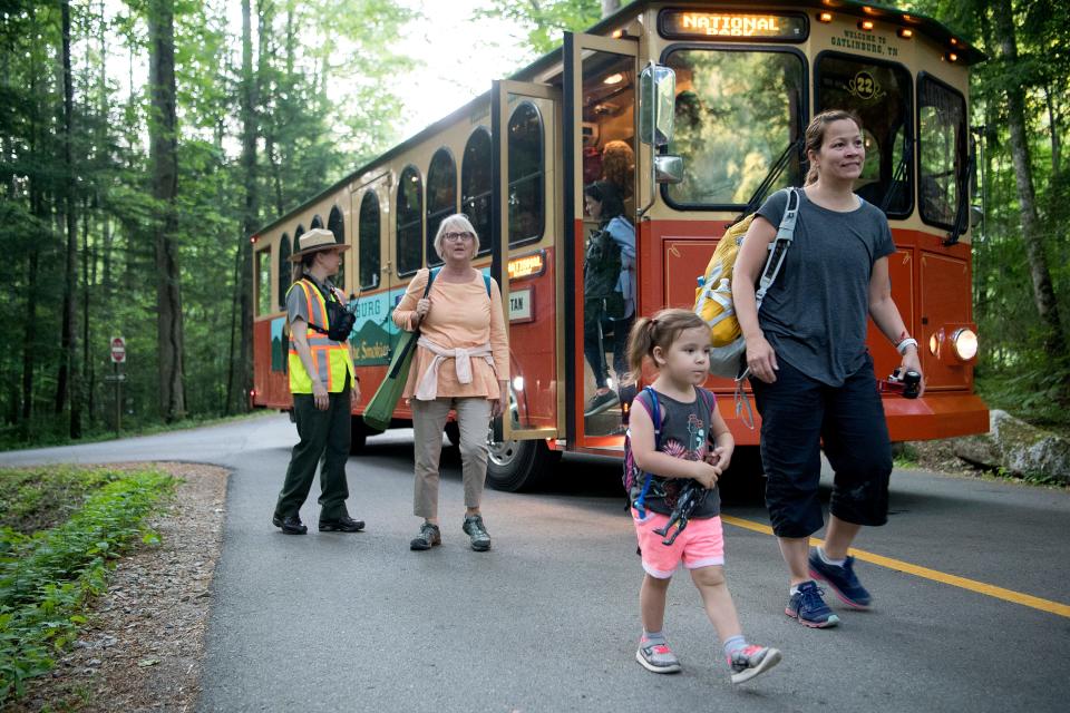 Visitors unload from trolleys and find a space along trails at the Elkmont Campground in the Great Smoky Mountains National Park to view the synchronous fireflies on June 3, 2019. The Smokies, the most visited park in the National Park Service, will send law enforcement rangers to assist in the Department of Interior-Border Patrol surge on the U.S.-Mexico border in FY 2020.