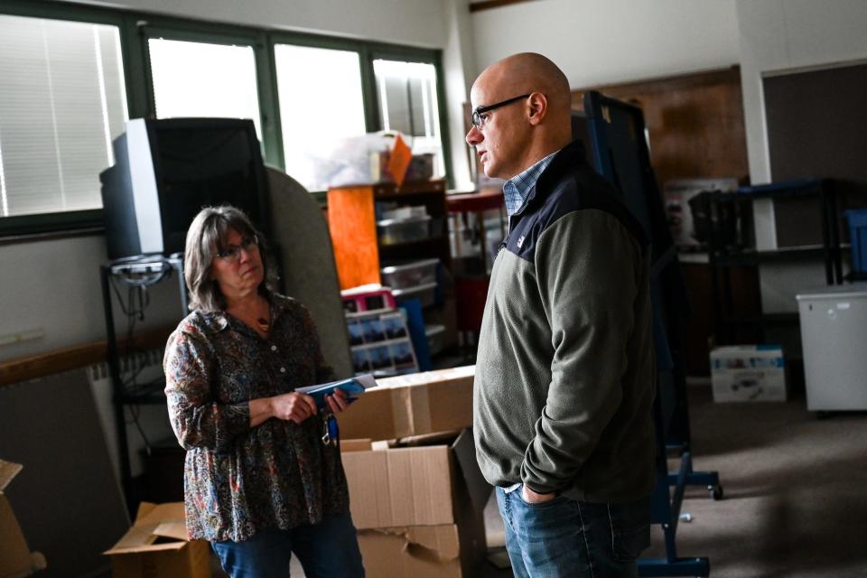 East Lansing City Manager George Lahanas, right, and Arts Assistant Director Wendy Wilmers Longpre talk about the future of the third floor of the Hannah Community Center on Friday, April 15, 2022, in East Lansing.