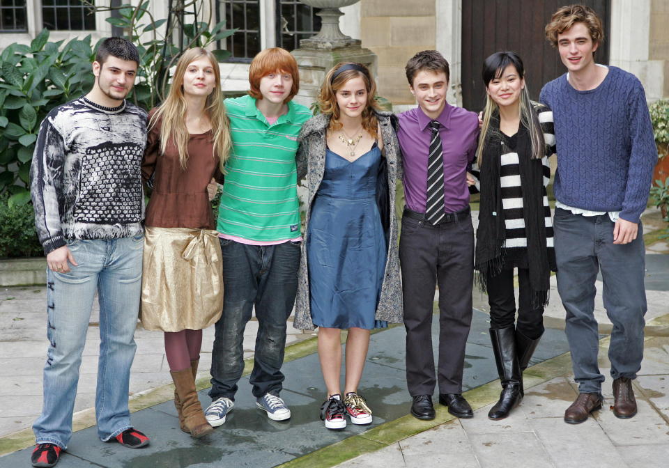 British actors (L to R) Stanislav Ianevski who plays Viktor Krum, Clemence Poesy who plays Fleur Delacour, Rupert Grint who plays Ron Weasley, Emma Watson who plays Hermione Granger, Daniel Radcliffe who plays Harry Potter, Katie Leung who plays Cho Chang and Robert Pattinson who plays Cedric Diggory in the forthcoming film "Harry Potter and the Goblet of Fire" attend a photocall in London October 25, 2005. The film which is the fourth in the series of Harry Potter films based on the books by [British author JK Rowling] will premiere in London on November 6.