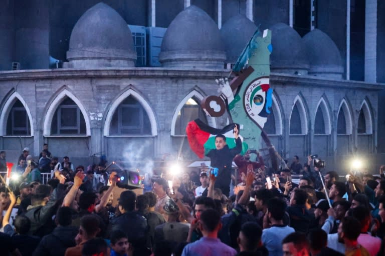 Gazans celebrated in the streets of Rafah after Hamas said it agreed to a truce proposal from Qatar and Egypt to pause the war with Israel (-)