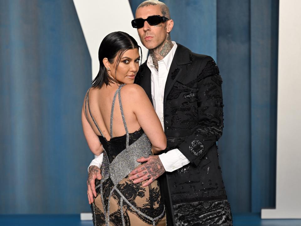 Kourtney Kardashian and Travis Barker at the 2022 Vanity Fair Oscar Party.