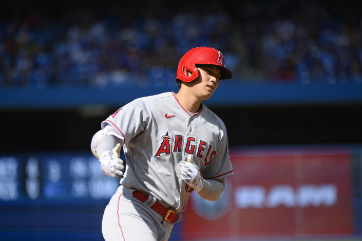 Los Angeles Angels designated hitter Shohei Ohtani (17) rounds the bases after hitting a two-run home run during the seventh inning of a baseball game against the Toronto Blue Jays, in Toronto, Sunday, Aug. 28, 2022. (Christopher Katsarov/The Canadian Press via AP)