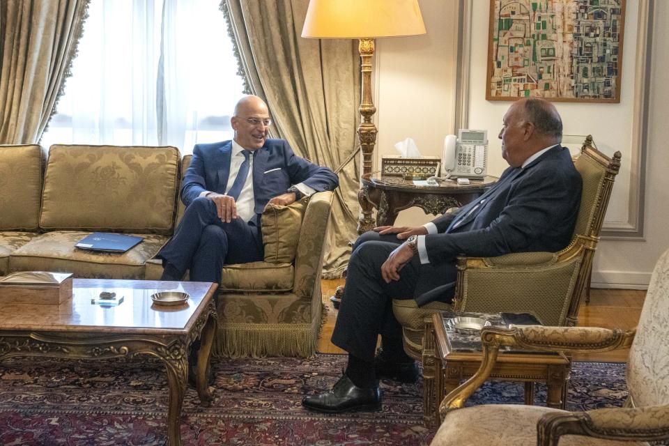 Egyptian Foreign Minister Sameh Shoukry, right, meets with Greek Foreign Minister Nikos Dendias , at the foreign ministry headquarters in Cairo, Egypt, Sunday, Oct. 9, 2022. (AP Photo/Nariman El-Mofty)