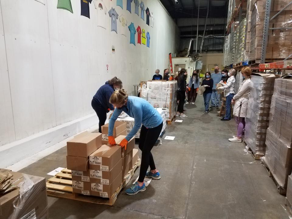 Volunteers sort food at the Second Harvest Operations Center. Second Harvest delivers food to 6 of Florida’s top 10 most food insecure counties.