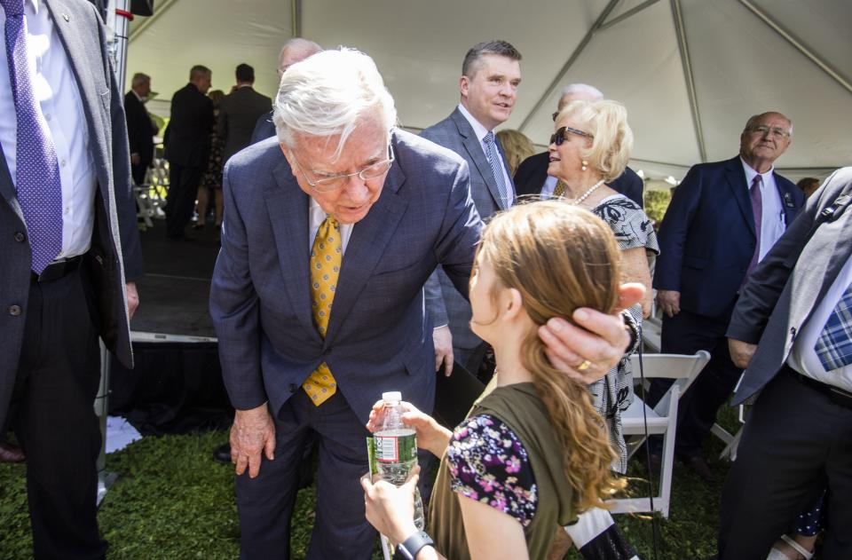 President M. Russell Ballard greets a young girl following the dedication of the Smith Family Memorial at Pine Grove Cemetery in Topsfield, Massachusetts.