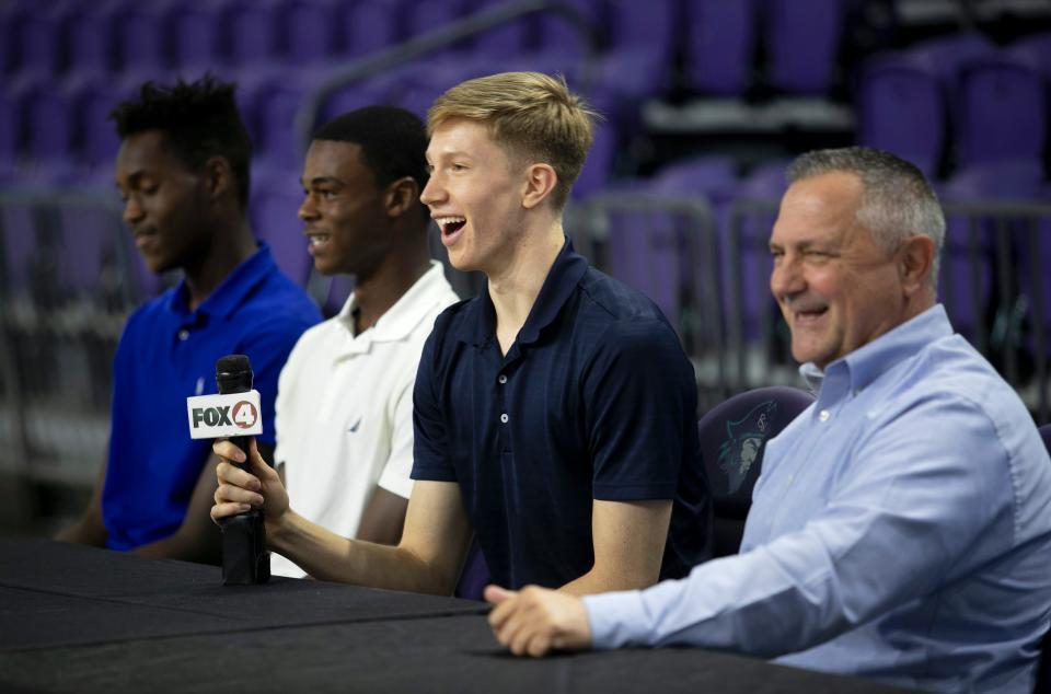 Canterbury basketball player Justin Heinrichs, center, answers a question about the three-point shootout at the press conference announcing the field for this year's City of Palms Classic at Suncoast Credit Union Arena in Fort Myers on Tuesday, Aug. 16, 2022. 