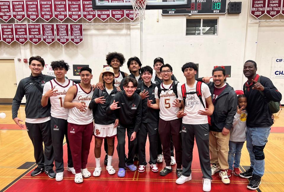 The Santa Paula High boys basketball team poses for a photo after defeating  San Gorgonio 70-53 at home Friday night to reach the CIF-Southern Section Division 5A championship game.