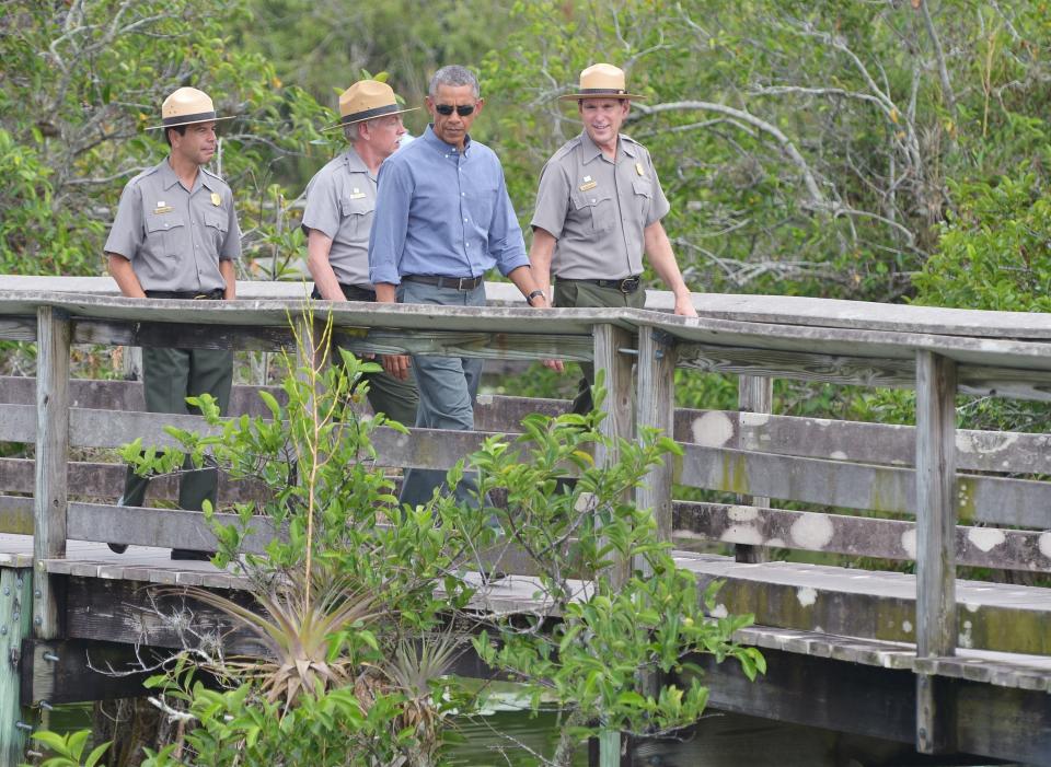 President Barack Obama walks on the Anhinga trail during a visit to Everglades National Park in Homestead, Florida, on April 22, 2015.