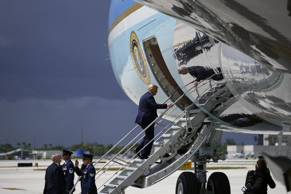 President Donald Trump boards Air Force One at Miami International Airport on Friday, July 10, 2020. (AP Photo/Evan Vucci)