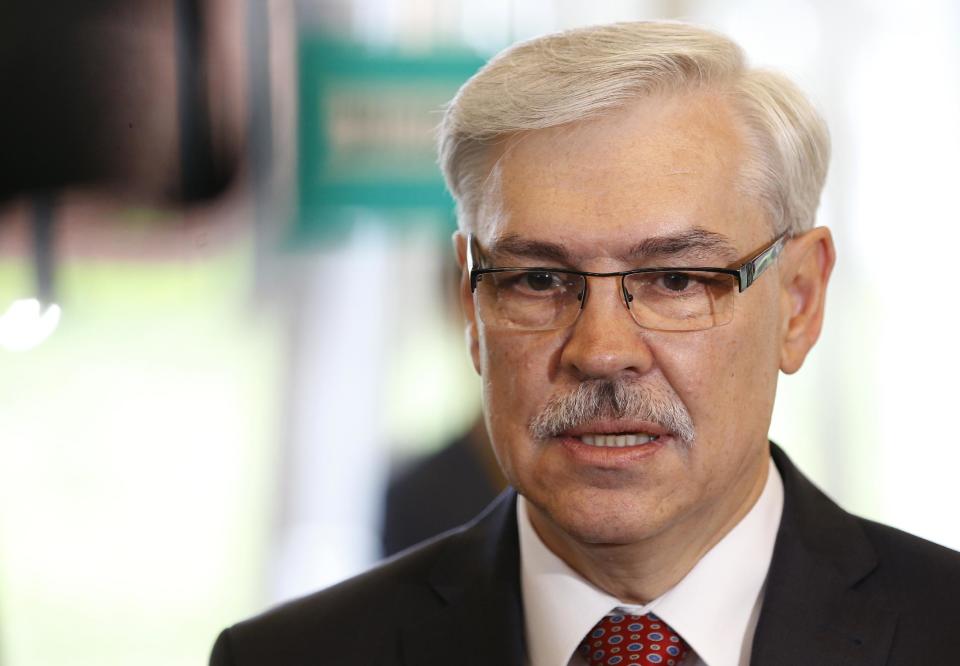 Lithuanian Social Democrat party leader and presidential candidate Zigmantas Balcytis speaks to the media at a polling station during the first round of voting in presidential elections in Vilnius, Lithuania, Sunday May 11, 2014. (AP Photo/Mindaugas Kulbis)