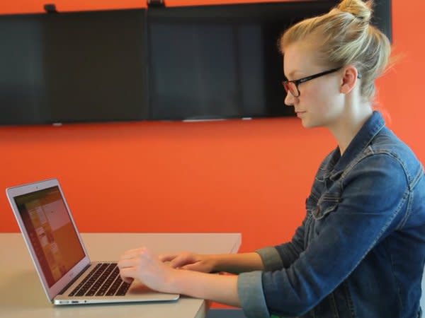 girl typing on computer