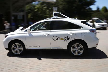 A Google self-driving vehicle drives around the parking lot at the Computer History Museum in Mountain View, California, in this file photo taken May 13, 2014. REUTERS/Stephen Lam