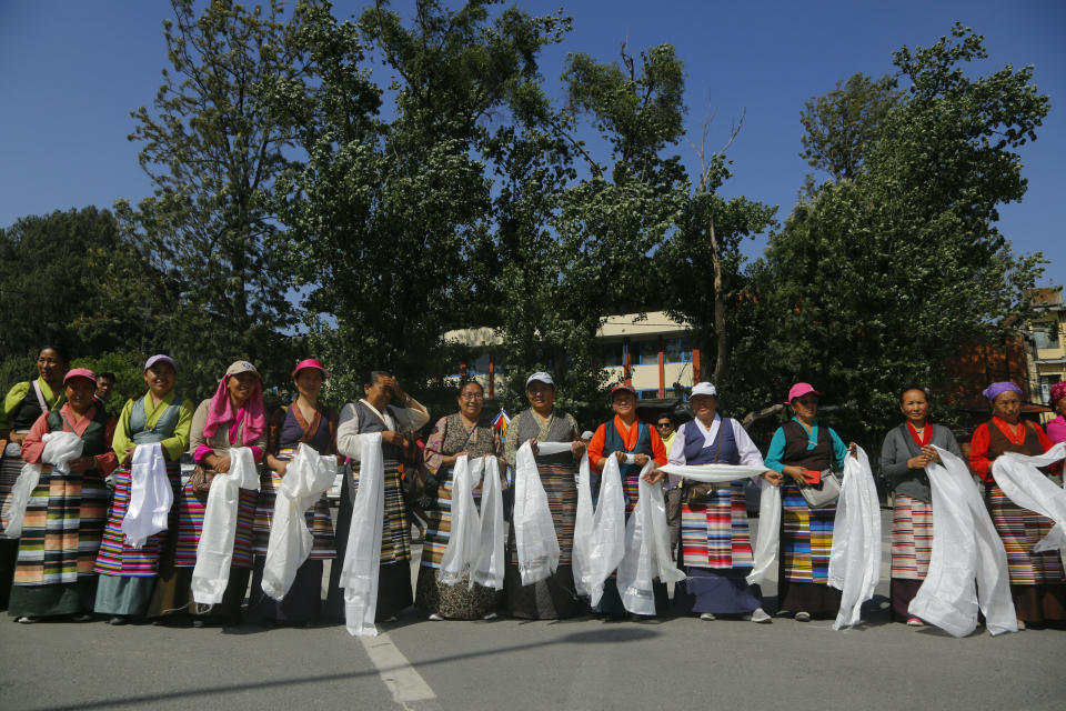 Family members and wellwishers wait to welcome Nepalese veteran Sherpa guide Kami Rita, 49, at the airport in Kathmandu, Nepal, Saturday, May 25, 2019. The Sherpa mountaineer extended his record for successful climbs of Mount Everest with his 24th ascent of the world's highest peak on Tuesday. (AP Photo/Niranjan Shrestha)