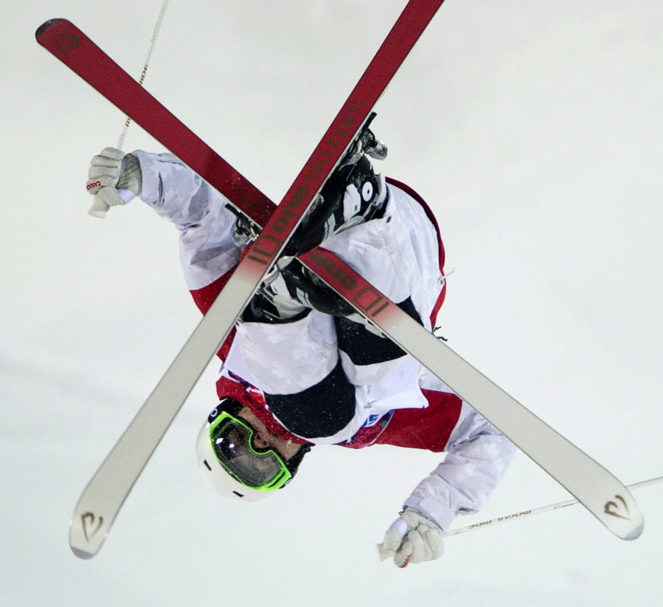 Canada's moguls skier Mikael Kingsbury flies over a jump during freestyle skiing training run at the 2014 Sochi Winter Olympics in Krasnaya Polyna, Russia, Wednesday, Feb. 5, 2014. (AP Photo/The Canadian Press, Jonathan Hayward)